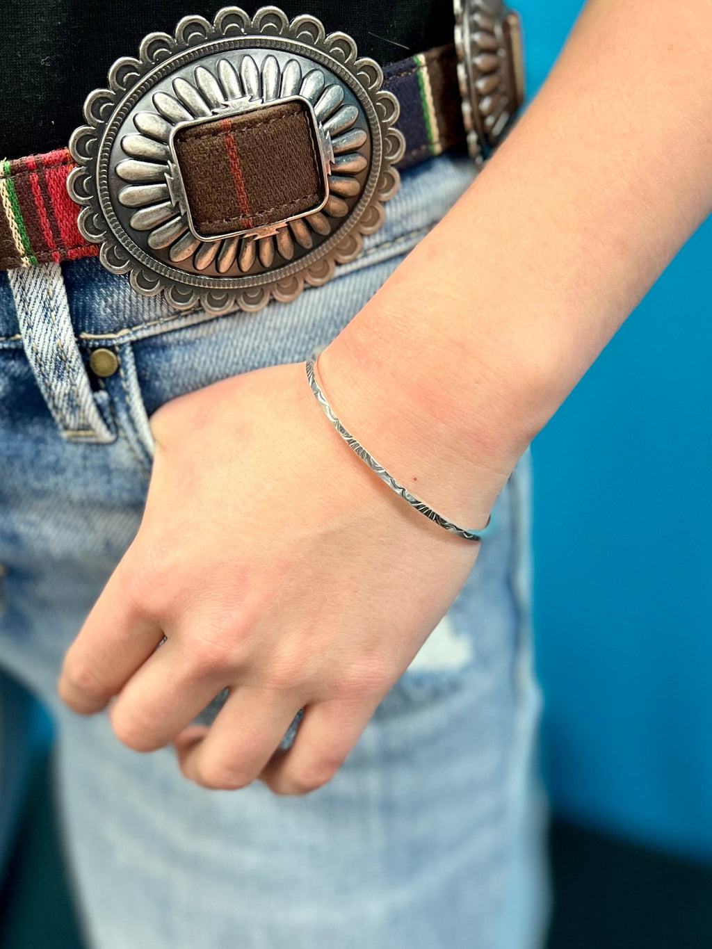 This gorgeous and authentic Native American Stamped Sterling Silver cuff bracelet is fit for a queen! Handcrafted with authentic Sterling Silver, turn heads with this dazzling and unique piece. Indian handcrafted with simple elegance.     Suggested Retail:$65.00