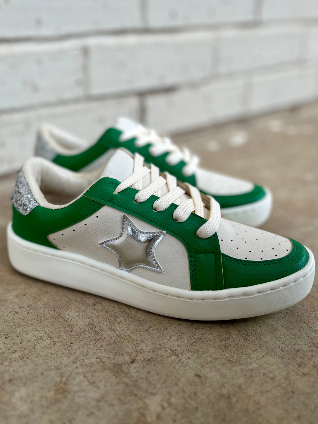 Green and white sneakers. Silver sneakers with a star on the side. Green sneakers. Golden Goose dupes. Affordable sneakers. Trendy sneakers. Game day sneakers. School spirit sneakers. Cheerleading sneakers. White sneakers. Silver star sneakers. Shoes. Sneakers. Women's shoes. Boutique. Women's boutique. Trendy boutique. 