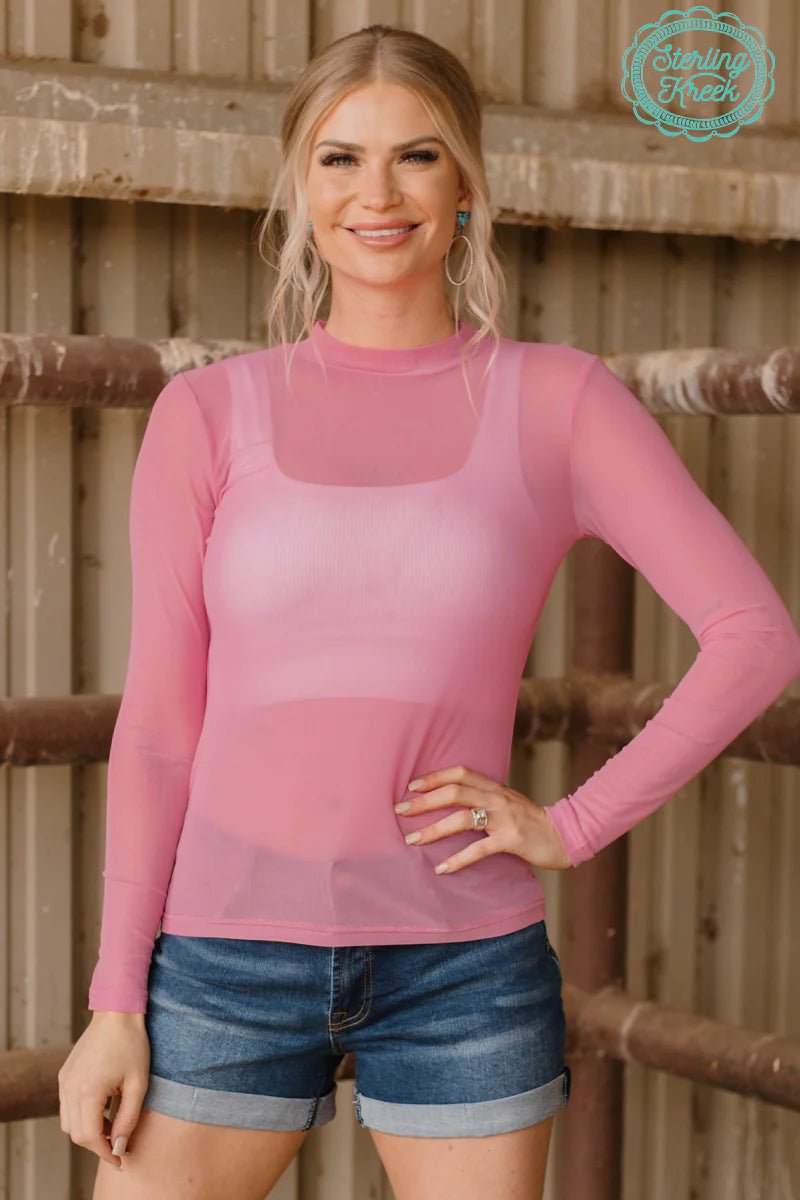 Sterling Kreek's Light Pink Meshed Out Top | Gussieduponline Crazy Train. Sterling Kreek Mesh tops. Trending mesh tops. Long Sleeve mesh tops. trendy. Mesh tops. light pink mesh top. Women's layering mesh top. Trending style. Women's fashion tends. Small business. all orders ship from Texas. Woman owned company 