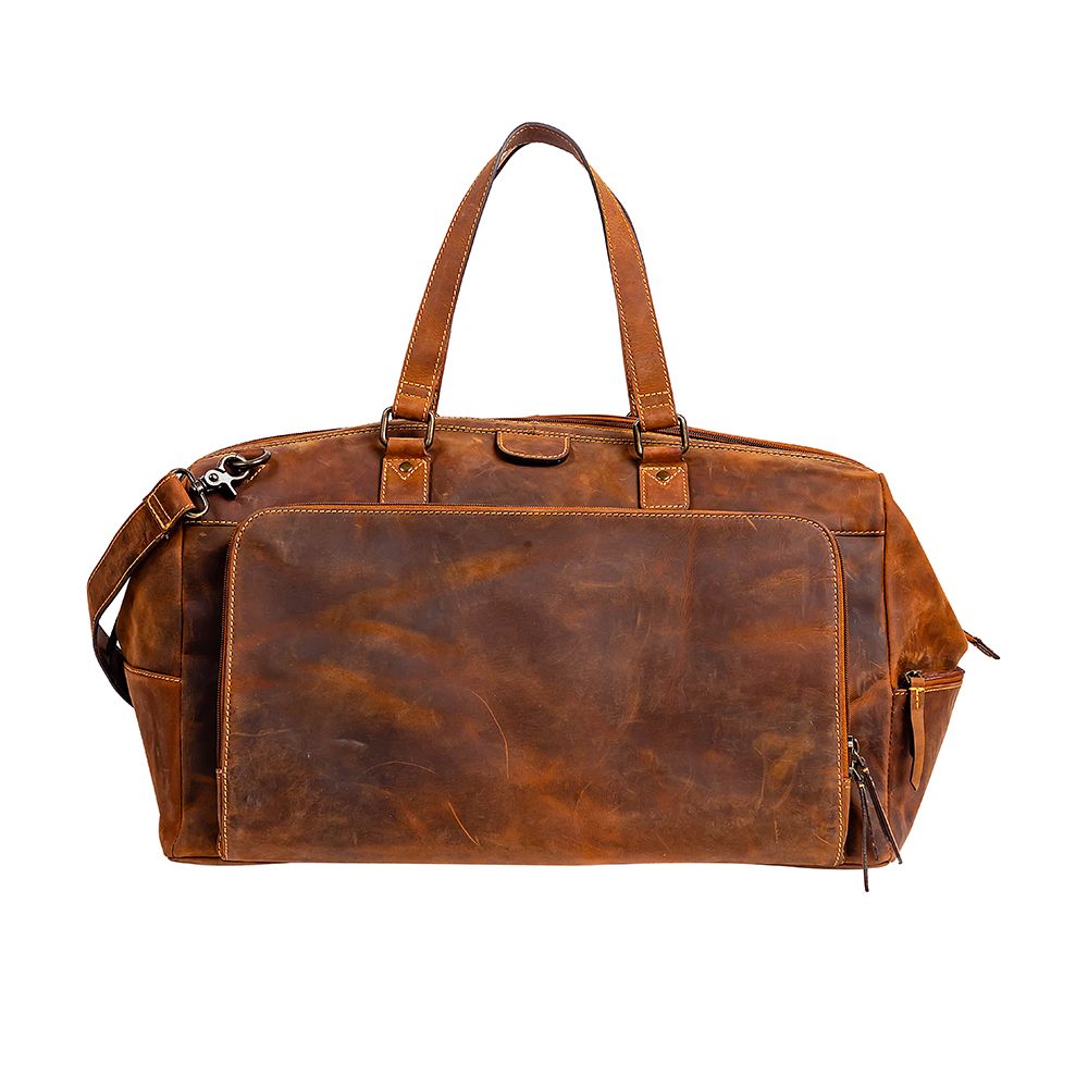 GENUINE LEATHER DUFFLE BAG. GENDER NEUTRAL LUGGAGE. LEATHER LUGGAGE. MYRA BAG. BOUTIQUE. SMALL BUSINESS. WOMAN OWNED. 