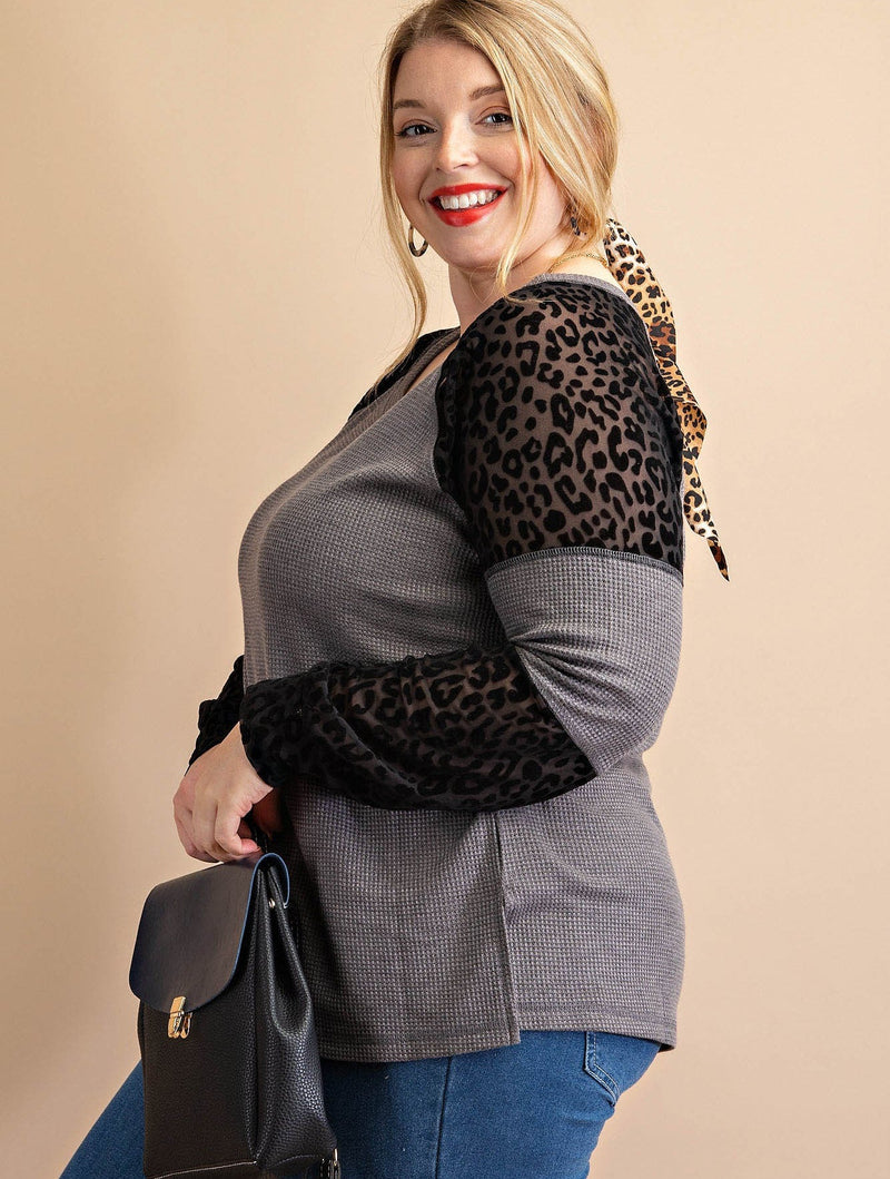 Watch the temps rise in this purrfect thermal top! It comes in a wild combo of Grey or Olive with sheer leopard print accents that are sure to turn heads. The super soft 92% polyester 8% spandex blend material feels totally luxe and keeps you cozy all season long. Meow!
