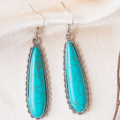 Treat your ears to a timeless look with these eye-catching Simple Tears Earrings. Crafted with an expert eye for detail, these earrings feature a stunning blend of turquoise and silver or copper and white for an eye-catching look that speaks of elegance and sophistication. With a length of 1.5”, they can be worn to the office or a night out.