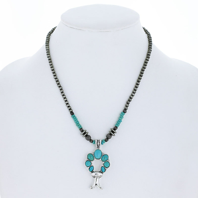 WESTERN SYNTHETIC SEMI STONE SQUASH BLOSSOM NAVAJO BEADED ADJUSTABLE PENDANT NECKLACE IN SILVER TONE METAL LENGTH: 18" EXTENSION: 3" DROP: 2” 