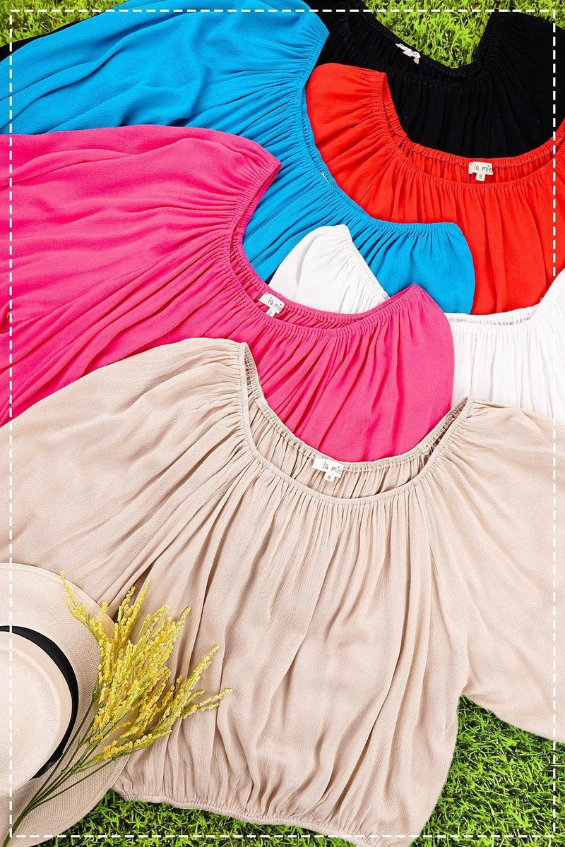 The Jenna In The Wind Top is the perfect wardrobe staple for effortless summer style. Crafted from lightweight and flowy fabric, this elegant off-shoulder top is finished with balloon sleeves and elastic bands at the wrist and waist for a flattering and comfortable fit. Its sophisticated design is ideal for dressing up with ease.  100% Rayon 