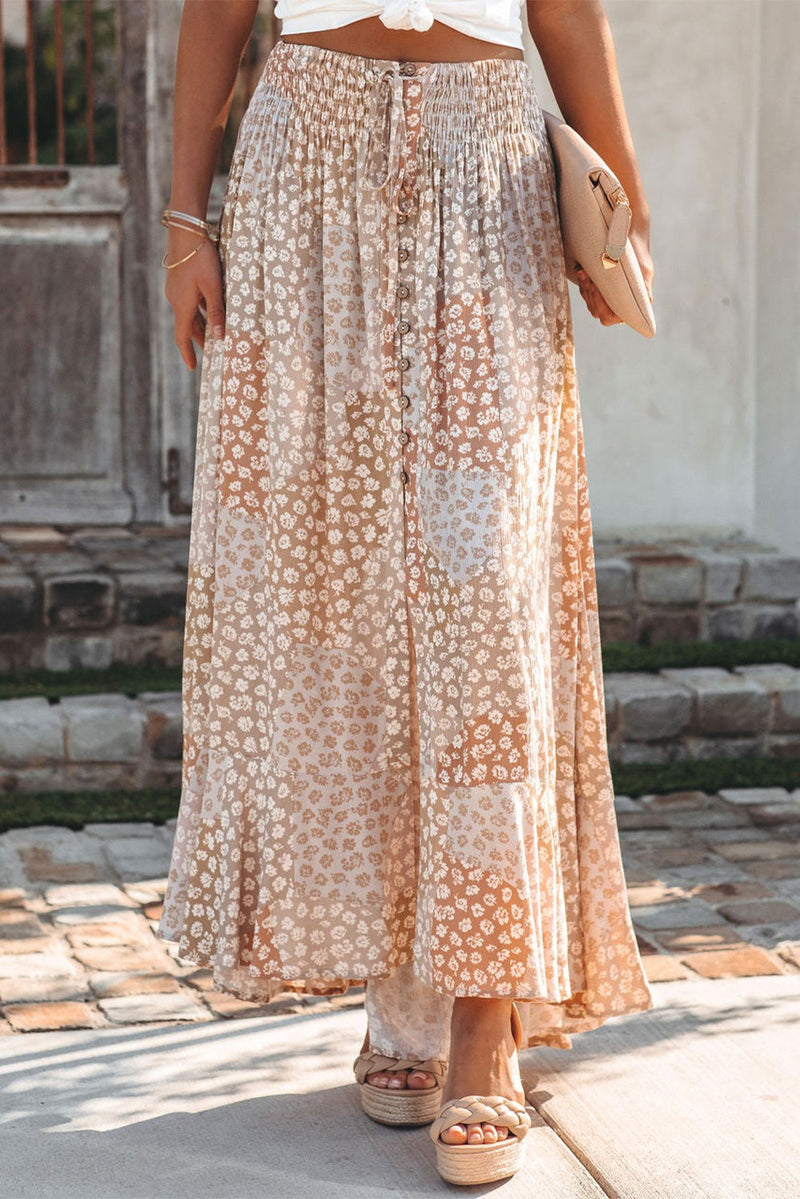 Experience comfort and high fashion in one with this beautiful Boho Floral Maxi Skirt. Made from lightweight, breathable material with a smocked waist and button slit for easy movement, this skirt is perfect for any occasion. Show off your style with a unique flower print and a flattering maxi length.