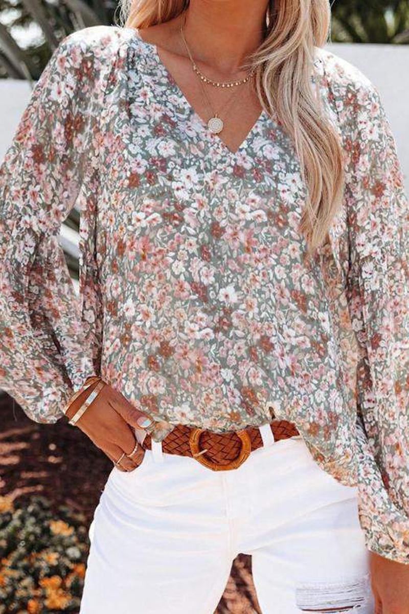 Make an effortless statement with this chic and casual New Era Floral Top! Featuring a vibrant floral print, unique lantern sleeves, and a V-neckline, it's the perfect addition to your wardrobe. And the best part? It's made of 100% Polyester for a lightweight feel! Look as marvelous as the blooms with this top!