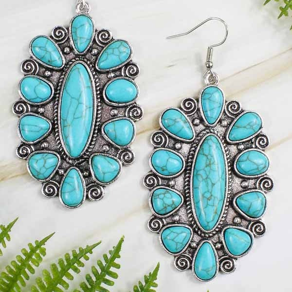 A unique statement-maker, these elegant Western Scroll & Stone Earrings are a must-have for any fashionista's jewelry box. Crafted with a sophisticated fish hook back, a detailed scroll design, and a multi stone pendant style, these earrings come in four colors - Turquoise & Copper, Turquoise & Silver, Copper & White, and Copper & Turquoise - to perfectly elevate any ensemble.