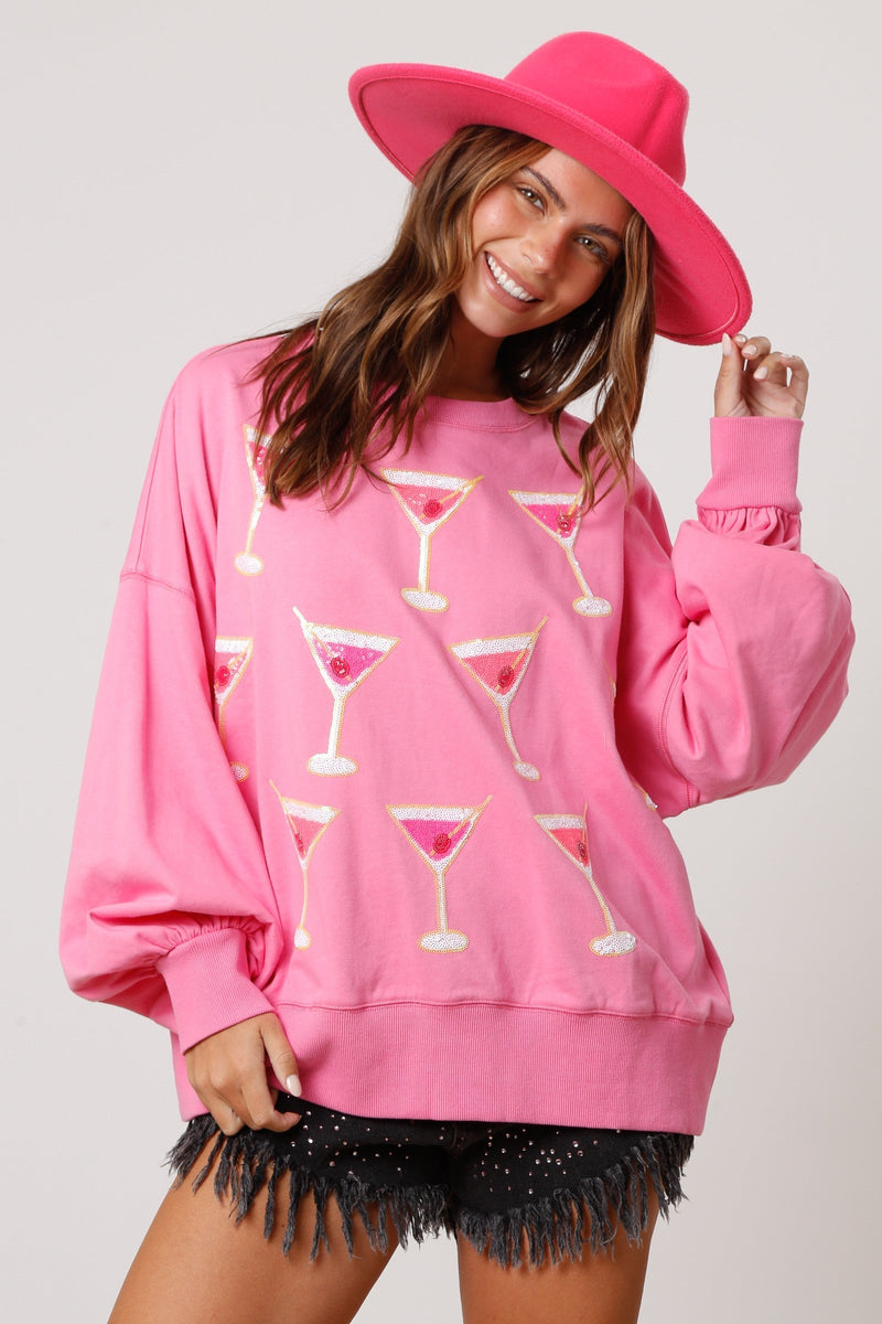 Party outfit, new year's, birthday party outfit. Pink sweatshirt with mini martinis with sequins. Get Gussied Up. Small Business. Woman Owned Business