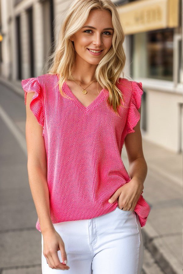 Spring top. Spring outfit. Coral top. Ribbed top. Ribbed texture. Soft shirts. Soft top. V-neck top. Flutter sleeves. Trending style. Women's style. Spring outfit. Women's fashion. Easy outfit. Comfortable outfit. Comfortable style. Cute and comfy clothes. Pink top. Women's boutique. Small business. Woman Owned.