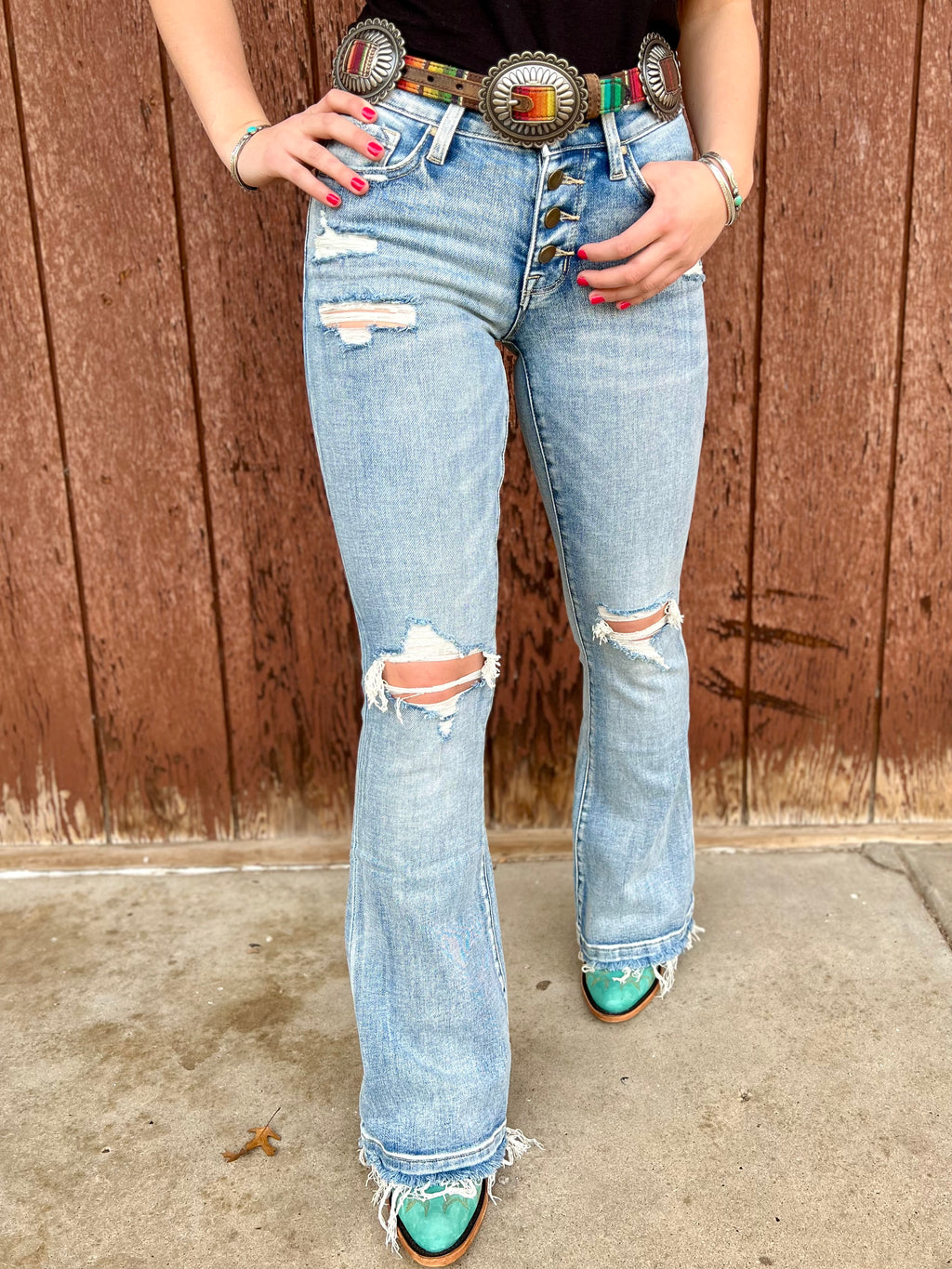 Stretchy Jeans. Button Fly. Light wash denim. Distressed. Frayed hem. Trending fashion. Boutique. Small business. Woman owned.
