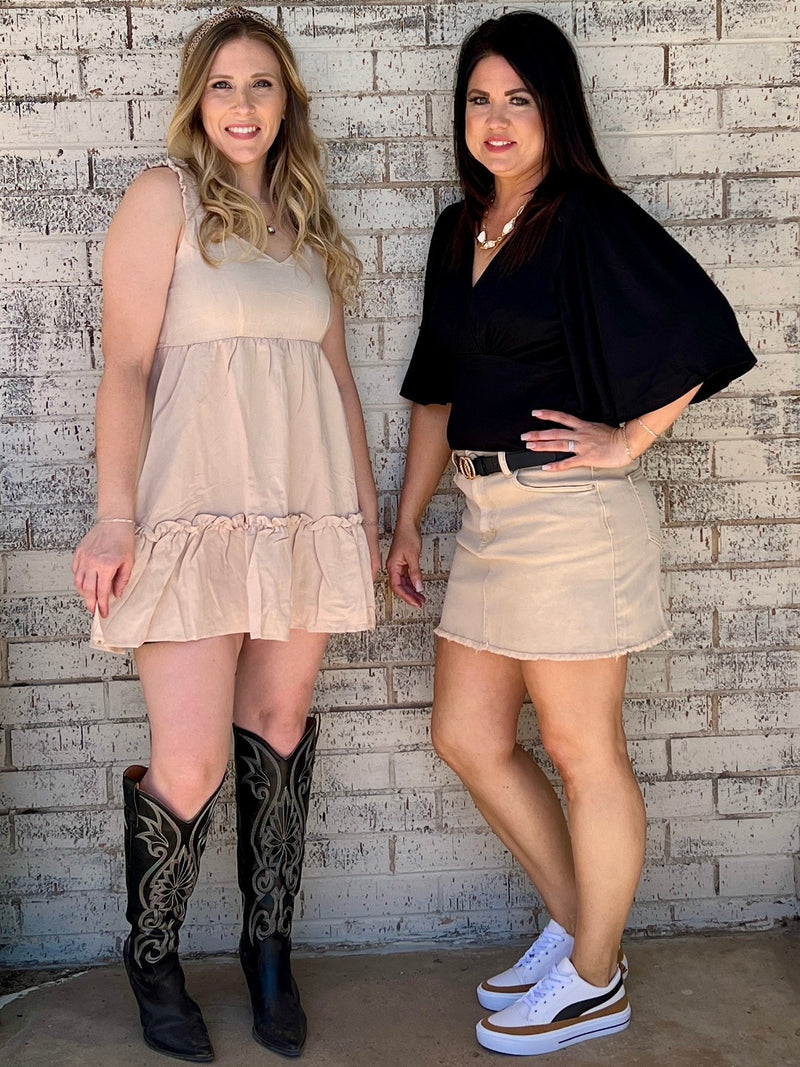 Casual everyday wear dress. Khaki dress. Solid color dress. Simple dress. Midi-dress. Spring dress. Dress with ruffles. Tan dress. Fashion trends. Women's fashion. Women's Style. Simple dress. Daily wear dress. Comfortable style. Boutique. Online women's boutique. Small business. Woman owned. Fast shipping from Texas.