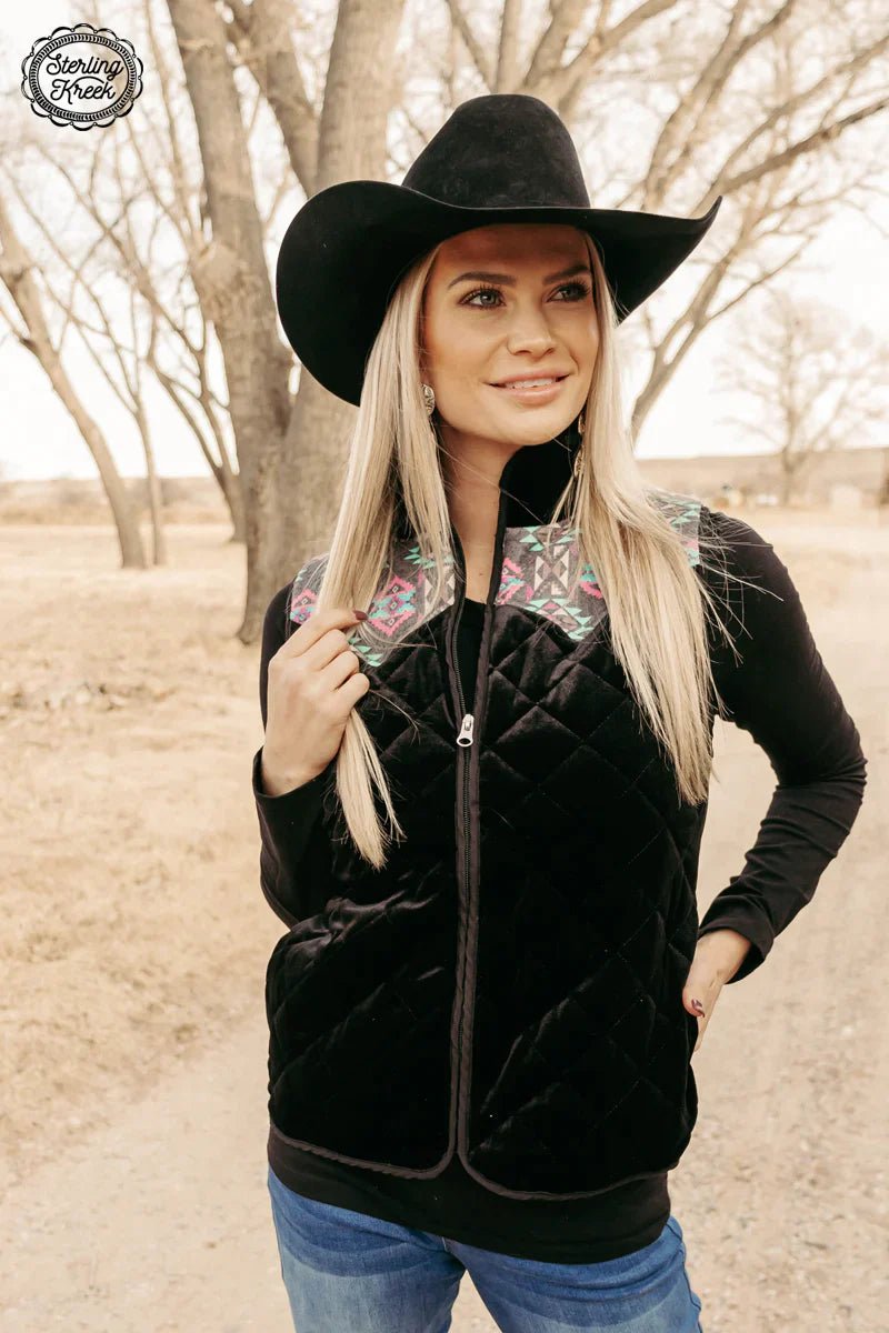 Look sharp and stay comfy with this black velvet quilted fabric jacket, featuring bright pink Aztec designs on the shoulders for an eye-catching finish. Perfect for cooler days! What more could you want?  100% polyester