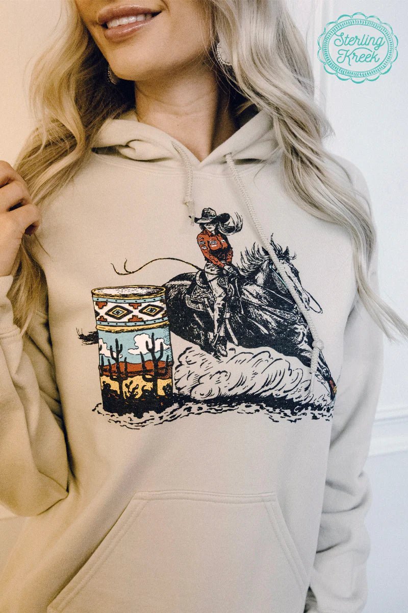 "Rev up your style game with the GET THE MONEY HOODIE! This tan hoodie features a playful drawing of a barrel racer, perfect for those who love a thrill. Stay cozy and make a statement with this quirky addition to your wardrobe. Catch eyes and make 'em green with envy!"   50% cotton 50% polyester  96% POLYESTER 4% SPANDEX