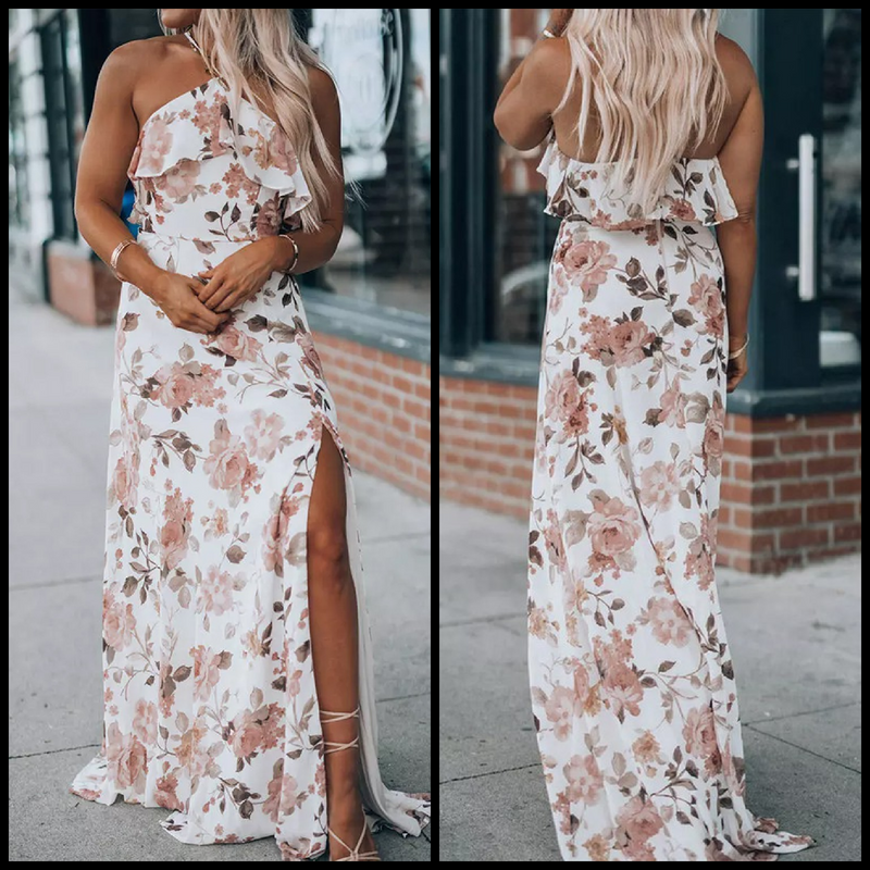 This Sophisticated Floral Halter Slit Dress is perfect for any occasion. The floor-length design features a white floral pattern, a ruffled halter top, and a side slit for enhanced movement. Crafted from 100% Polyester, this dress exudes elegance and sophistication.