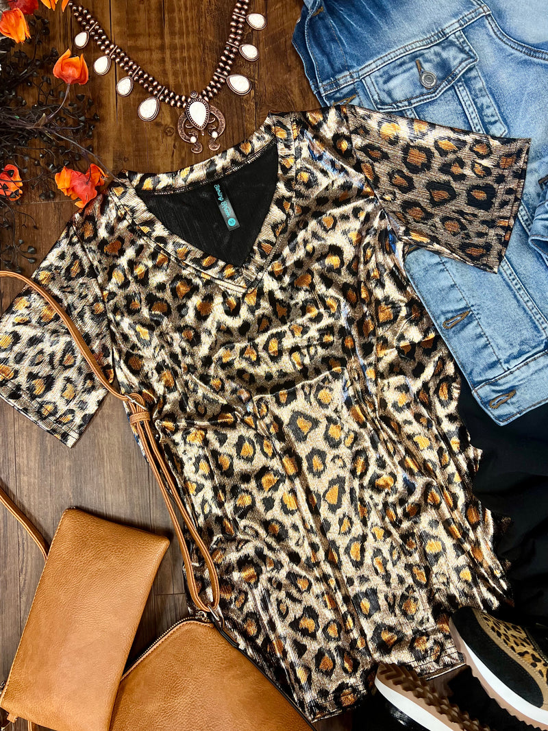 Gold metallic leopard print top. Metallic leopard v-neck shirt. Leopard print v-neck. Metallic cheetah print top. Women's western wear. Women's western boutique. Women's trending fashion. Online boutique. Small business. 
