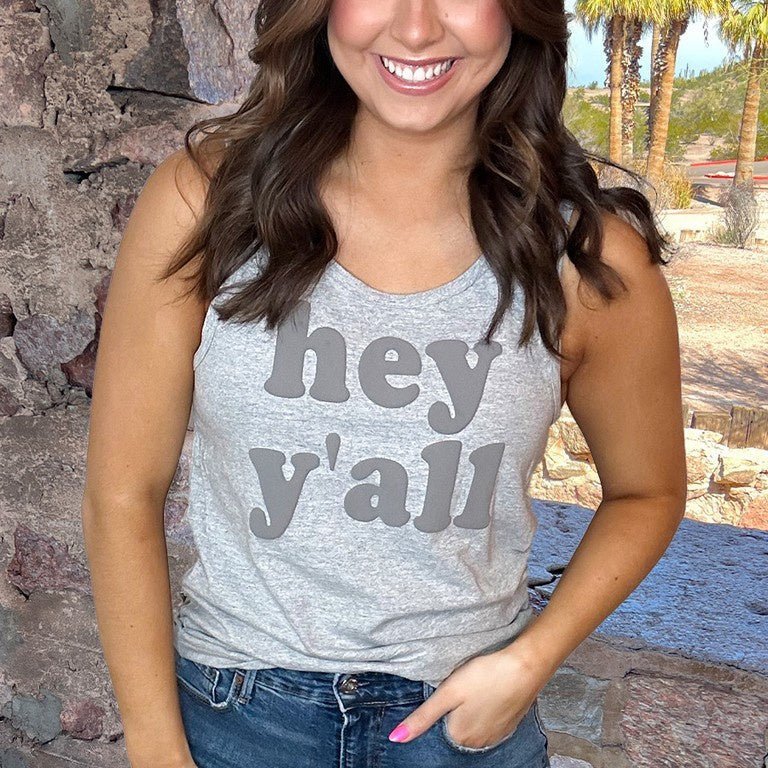 Take your style game up a notch with our Hey Y'all Tank Top! Perfect for a summer day out, this grey tank is printed with the classic phrase, HEY Y'ALL. Enjoy its raised 3D effect for a unique look, plus the premium cotton will keep you comfortable all day long. Ready for some fun under the sun? Get to steppin' in this tank!  100% Cotton