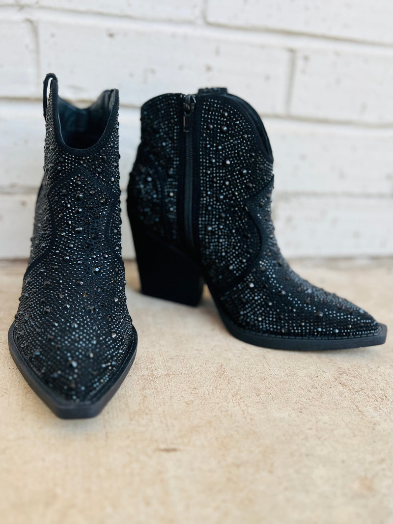 The Leg Up Black Booties are your shortcut to style! With a 3" heel, pointed toe and black rhinestone details, you'll strut in confidence and find your way through life with ease. Plus, the inside zipper means you won't find yourself endlessly searching for a way out. Look great, feel great! 8" in total height