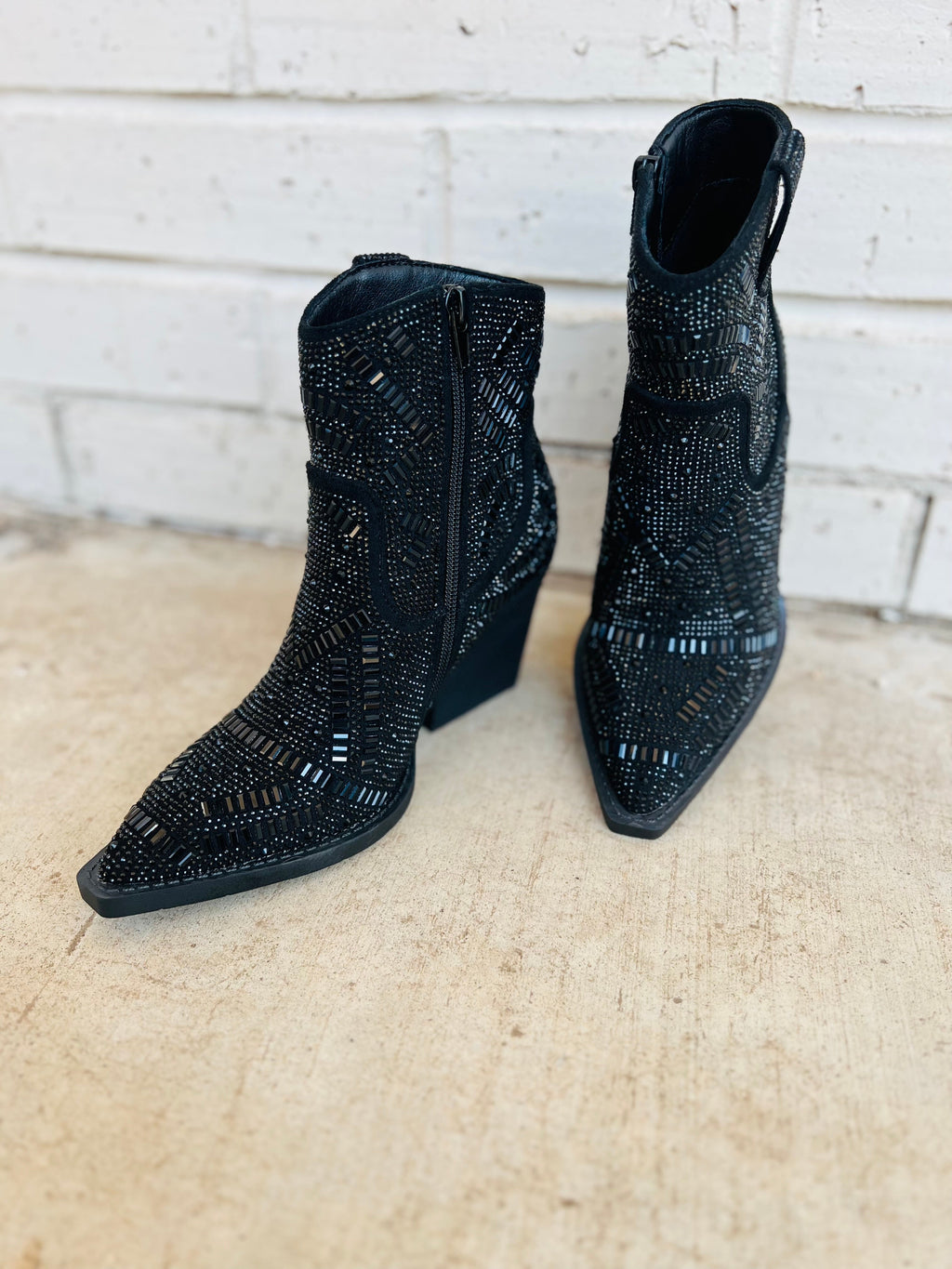 The Black Maze of Life Booties are your shortcut to style! With a 3" heel, pointed toe and black rhinestone maze design details, you'll strut in confidence and find your way through life with ease. Plus, the inside zipper means you won't find yourself endlessly searching for a way out. Look great, feel great!