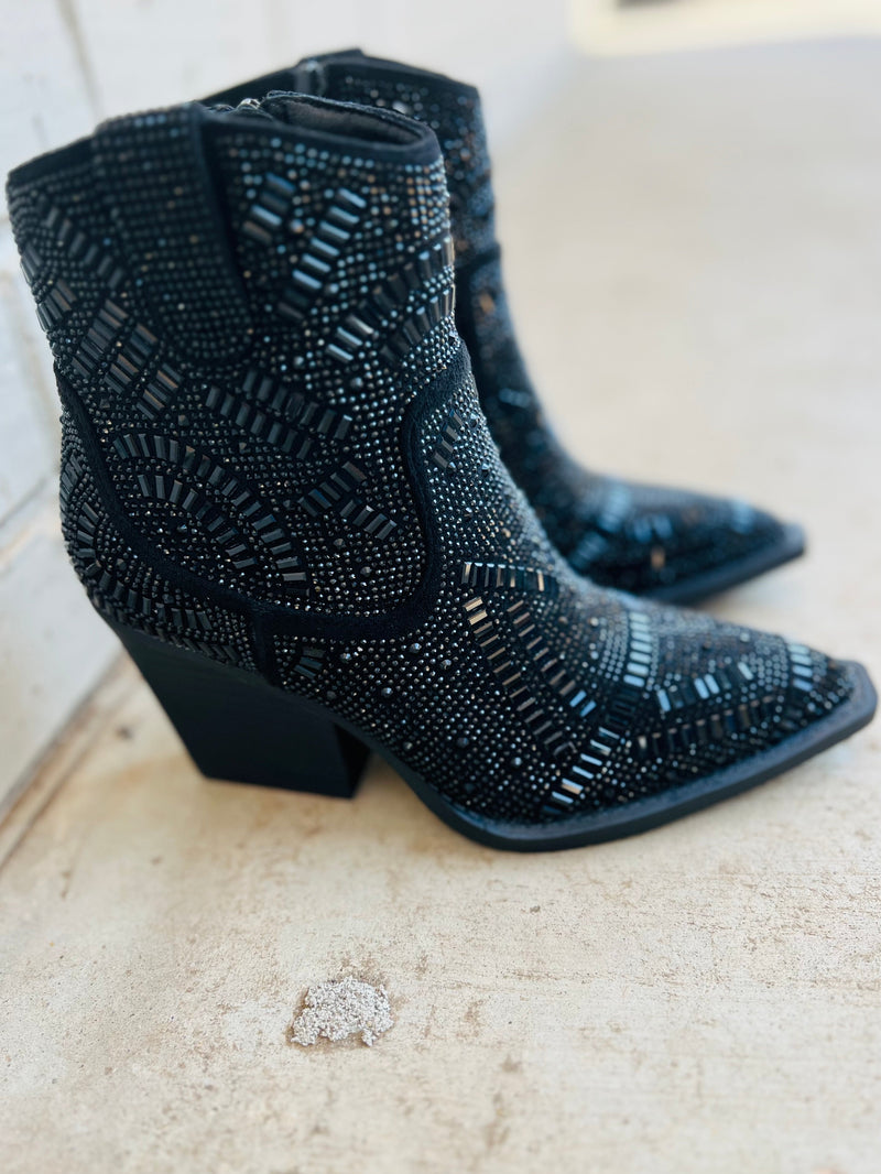 The Black Maze of Life Booties are your shortcut to style! With a 3" heel, pointed toe and black rhinestone maze design details, you'll strut in confidence and find your way through life with ease. Plus, the inside zipper means you won't find yourself endlessly searching for a way out. Look great, feel great!