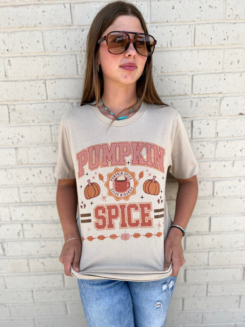 Fall for this festive 'Pumpkin Spice' tee! It's made of 100% cotton in soft fall colors with a graphic of pumpkins and pumpkin spice. It's a perfect pick-me-up for those cozy days when you want to wear something comfy and fun. Spice up your wardrobe!