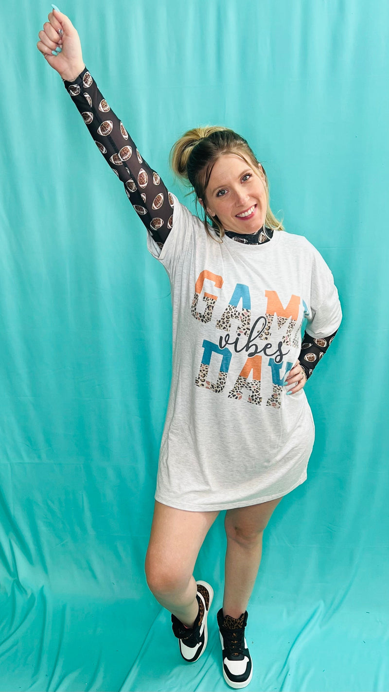 Look and feel your best on game day with this vintage-cool T-Shirt dress! The oversized grey piece features a splash of bold colors, with leopard print, turquoise, and orange accents - talk about wild fans! It’s the perfect way to show you’ve got ‘Game Day Vibes’!  78% Polyester, 18% Rayon, 4% Spandex