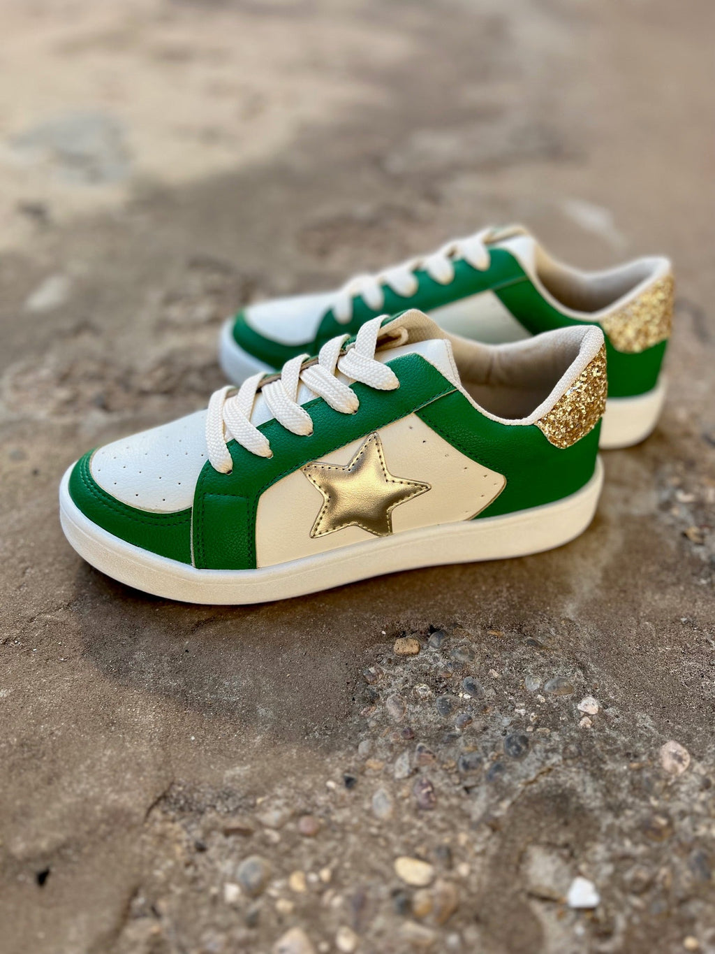 Green and white sneakers. Gold sneakers with a star on the side. Green sneakers. Golden Goose dupes. Affordable sneakers. Trendy sneakers. Game day sneakers. School spirit sneakers. Cheerleading sneakers. White sneakers. Gold star sneakers. Shoes. Sneakers. Women's shoes. Boutique. Women's boutique. Trendy boutique. 
