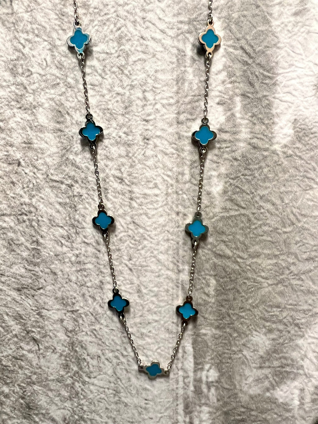 Be a force of nature with this statement piece! This Turquoise and Silver Point Necklace is sure to bring out your inner goddess! 16" of silver chain with a 3" adjustable lobster clasp, featuring a turquoise epoxy cross design -- you can't go wrong with this one-of-a-kind look!
