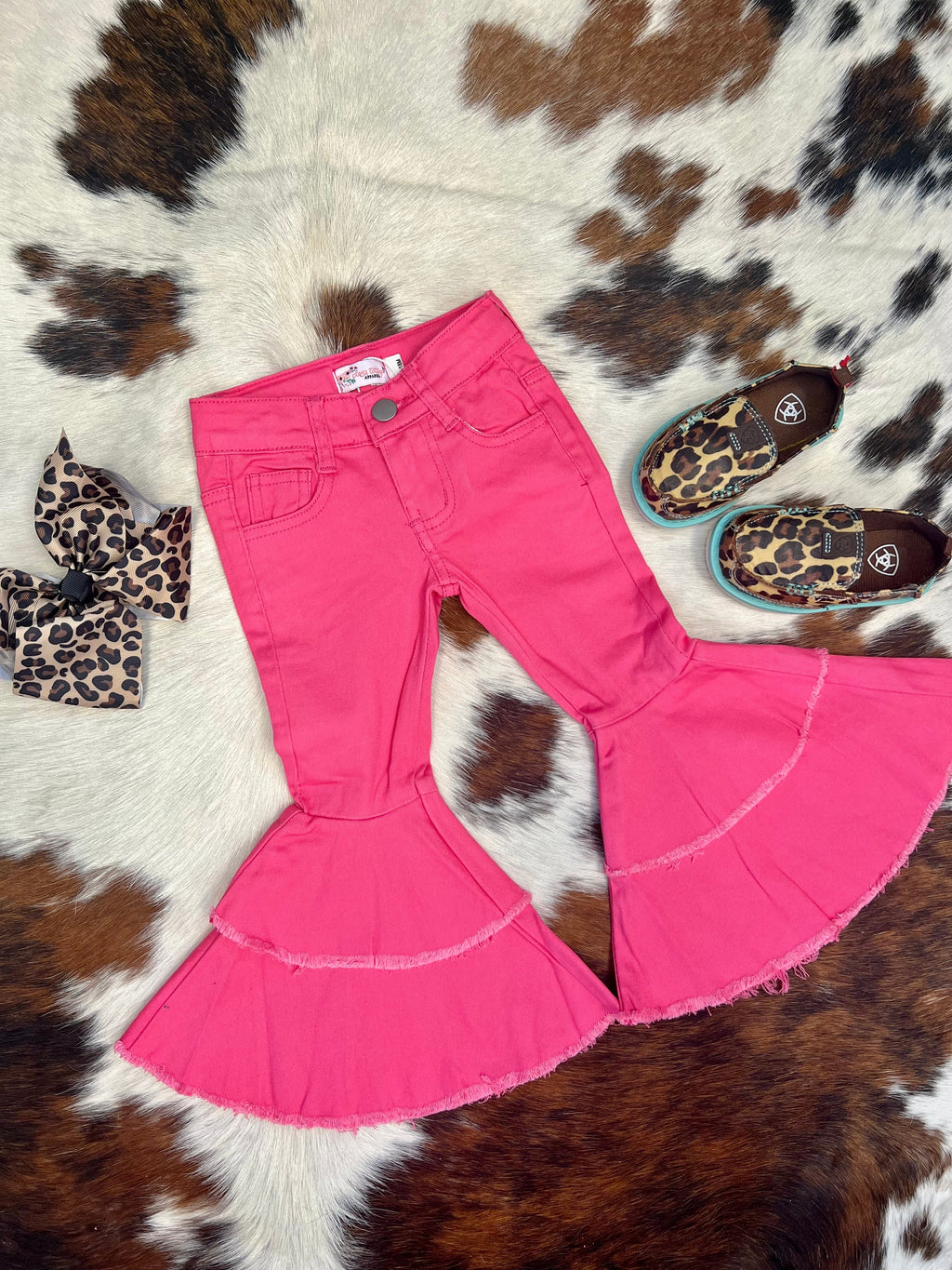 Your The Little Lainey's Pink Bells will be rocking the trendiest jeans around with these cool bell bottoms! With a pink wash and western-style silhouette, these pink fab bell bottoms will have them looking hip and stylish. The double tiered hem gives a unique touch, ensuring their look stands out from the crowd. Time to up their fashion game!