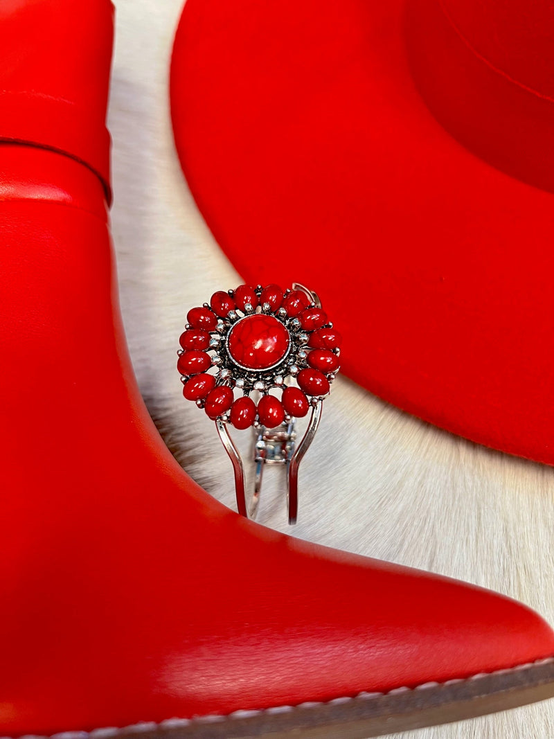 Our Seeing Red Bracelet will have you looking stylishly wild. With its Western-inspired design and a round stone pendant accentuated with red stones, this cuff bracelet will add a fierce touch to your wardrobe. Not to mention, its charm size of 2", and diameter of approx 3" will fit you perfectly. Get ready to hit the town in the ultimate fashion statement—nickle free!