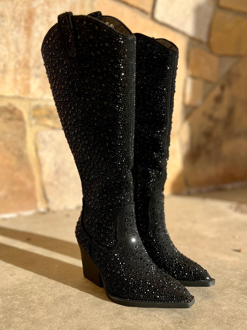 Add Glamour to any party with these Tall In a Black Cadillac Boots with all over black rhinestone detailing. These boots have a Pointed Toe Silhouette,  side inside ankle zipper closure, 3" wooden block heel, 15" knee length from ankle to top of boot.  18" total inches tall from sole to top of Bootie.  