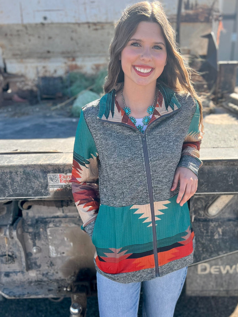 Look stylish and stay cozy in the Country Girl Jacket! This zip-up features waffle aztec sleeves, 90% polyester and 10% spandex, and comes in a variety of colorful hues. Get your perfect country chic look today!