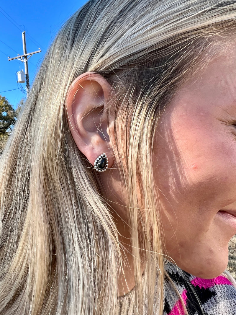 These sophisticated Black Onyx Stud Earrings are crafted from genuine sterling silver featuring an intricate tear drop shaped black onyx stones. These studs measure 1/4" in size and have a classic post back closure. The perfect accessory for an elegant look.  Suggested Retail:$75