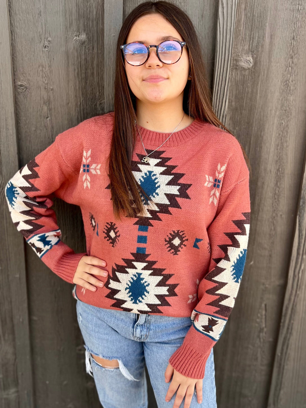 Wrap yourself up in warmth and style with this cozy Pink Southwestern Sweater. Crafted from the softest material, this sweater is sure to keep you warm and cozy all season long while drawing admiring eyes with its eye-catching Pink Aztec Pattern. Be ready to take on the day with this beautiful piece of fashion!  True to size   42% Acrylic 30% Polyester 28% Nylon