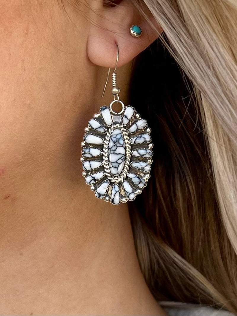 Indulge in premium style with these Unforgettable Navajo Sterling Silver Earrings. Handcrafted by Native American artisans and finished with genuine sterling silver, these earrings display a unique concho style and feature breathtaking authentic zebra stones. A sophisticated eye-catcher, these earrings feature fish hook dangles and measure 2" in length. Upgrade your style to a new level of luxury.