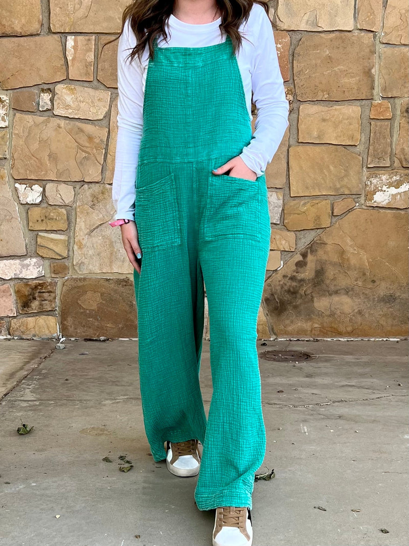 Teal romper. Women's oversized romper. Teal Overalls. Mineral washed overalls. Mineral washed teal overalls. Women's lounge jumper. Mineral washed romper. Mineral washed jumper. Women's comfort romper. Women's western boutique. Western boutique. Online boutique. Women's western wear. Trending fashion. Small business. Woman owned. Women's western fashion. Women's western apparel. 