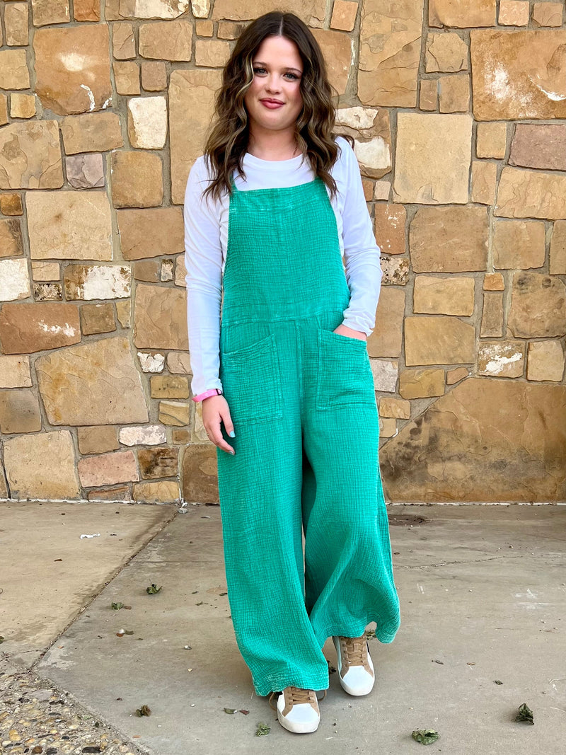 Teal romper. Women's oversized romper. Teal Overalls. Mineral washed overalls. Mineral washed teal overalls. Women's lounge jumper. Mineral washed romper. Mineral washed jumper. Women's comfort romper. Women's western boutique. Western boutique. Online boutique. Women's western wear. Trending fashion. Small business. Woman owned. Women's western fashion. Women's western apparel. 