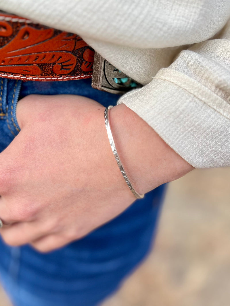 his gorgeous and authentic Native American Stamped Sterling Silver cuff bracelet is fit for a queen! Handcrafted with authentic Sterling Silver, turn heads with this dazzling and unique piece. Indian handcrafted with simple elegance.