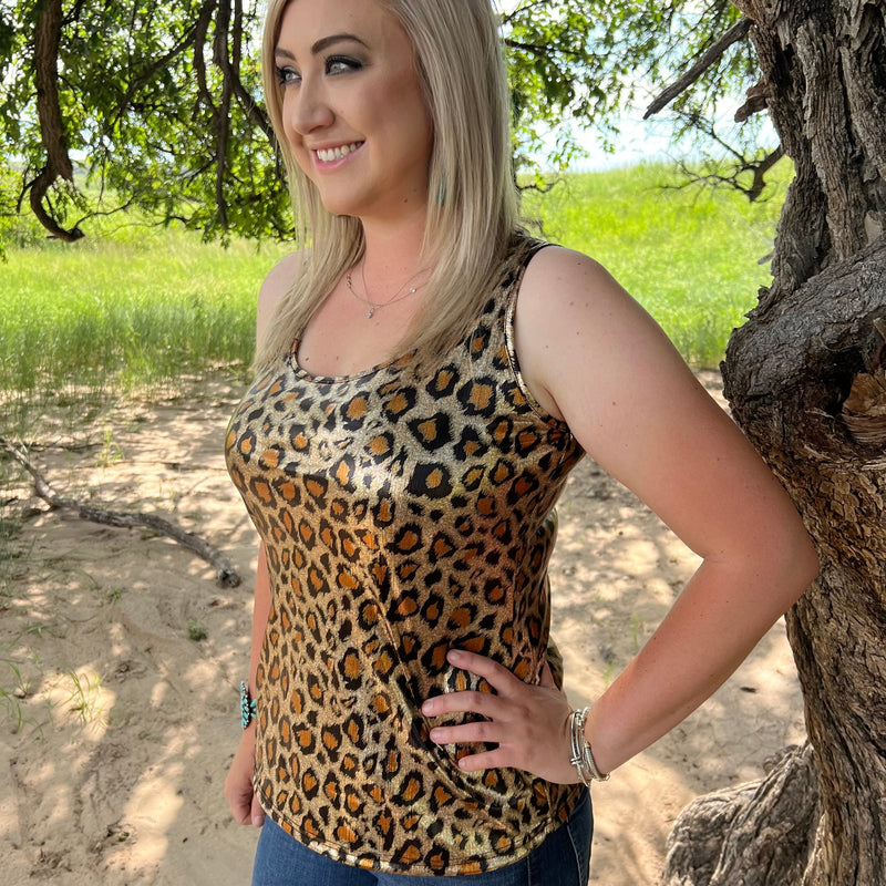 Look totally fierce and stylish in our Livin' The Dream Tank with its subtle but eye-catching gold metallic leopard print. Life's a party and you're the star with this tank! 😎  95% polyester 5% spandex