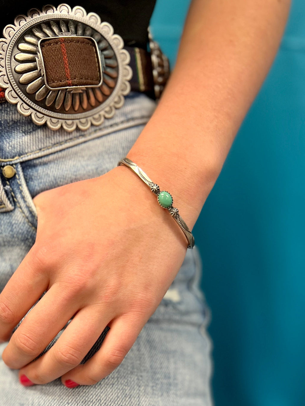This gorgeous and authentic Native American Stamped Sterling Silver cuff bracelet is fit for a queen! Handcrafted with authentic Sterling Silver and a Genuine Turquoise Stone, it will turn heads with this dazzling and unique piece. Indian handcrafted with simple elegance.     Suggested Retail:$200.00