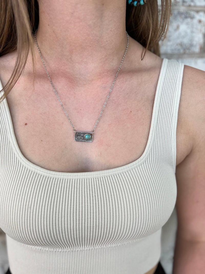 This beautiful Mrs. Turquoise Necklace features a 17" silver chain and a 3" adjustable clasp for customized fit. Crafted with a genuine turquoise stone, it's sure to make a statement of elegance and sophistication.