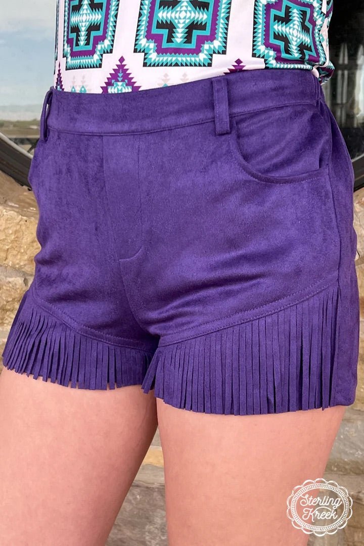 Shake up your style with the Nashville Babe Shorts! These purple suede fringed shorts will make you the envy of Music City! So strut your stuff and show off your one-of-a-kind style! Yee-haw!     92% POLYESTER 8% SPANDEX