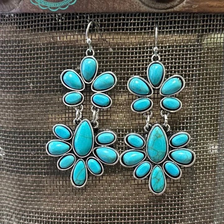 Treat yourself to these "dangly" turquoise earrings and add some fun to your look! These medium-sized earrings are perfect for your Saturday night out or for making a statement in the office. Get ready to get noticed - in a good way!  LENGTH: 2"
