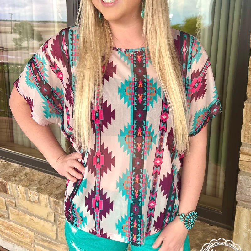 Climb onto the wagon and take a wild West-inspired ride with the PLUS Riders In The Sky! This cream colored mesh top is patterned with pretty pink and turquoise Aztec designs - perfect for your next fashion frolic! Yee-haw!  96% POLYESTER 4% SPANDEX