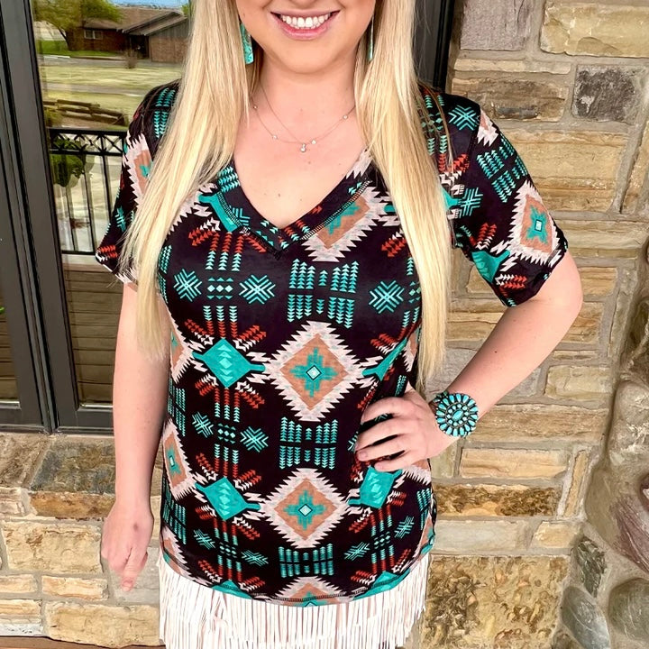 Put your style in double trouble with this reversible top! Whether you're looking to stand out in cheetah or blend in with subtle aztec, this top has got you covered. With the PLUS Twice the Trouble, you don't have to choose between two good looks—you can have them both!  50% Polyester, 45% Cotton, 5% Spandex
