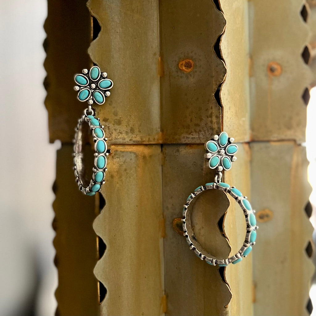 These Floral Turquoise Hoops add some flowers to your fashion! Crafted with a western concho style, high polish silver, and round ring hoop, they feature gorgeous turquoise stones to give you just the right amount of bling. Don't let 'em pass you by!