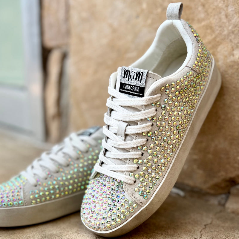 Our Silver Rhinestone Sparkle Sneakers take casual to the next level with the neutral beige colored suede and multi-color all over rhinestone detail. The combination of these features ensures an eye-catching look, while the soft beige suede and comfort sole provides all day comfort.