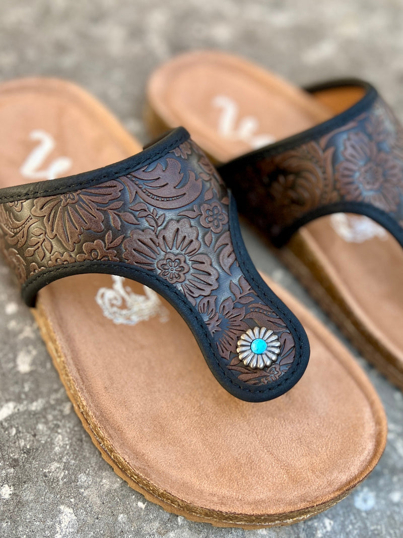 tooled floral leather. comfortable. silver concho. small turquoise stone. True to size. brown leather. Small Business. Woman owned. Western boutique. .