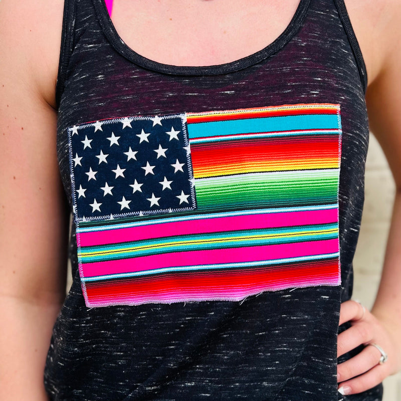 Stay cool in the heat of summer in this stylish PLUS size racer back tank. Made of 91% polyester and 9% cotton for full breathability, this black marble tank features a bright, multi-colored serape print flag design for a look that is sure to turn heads.