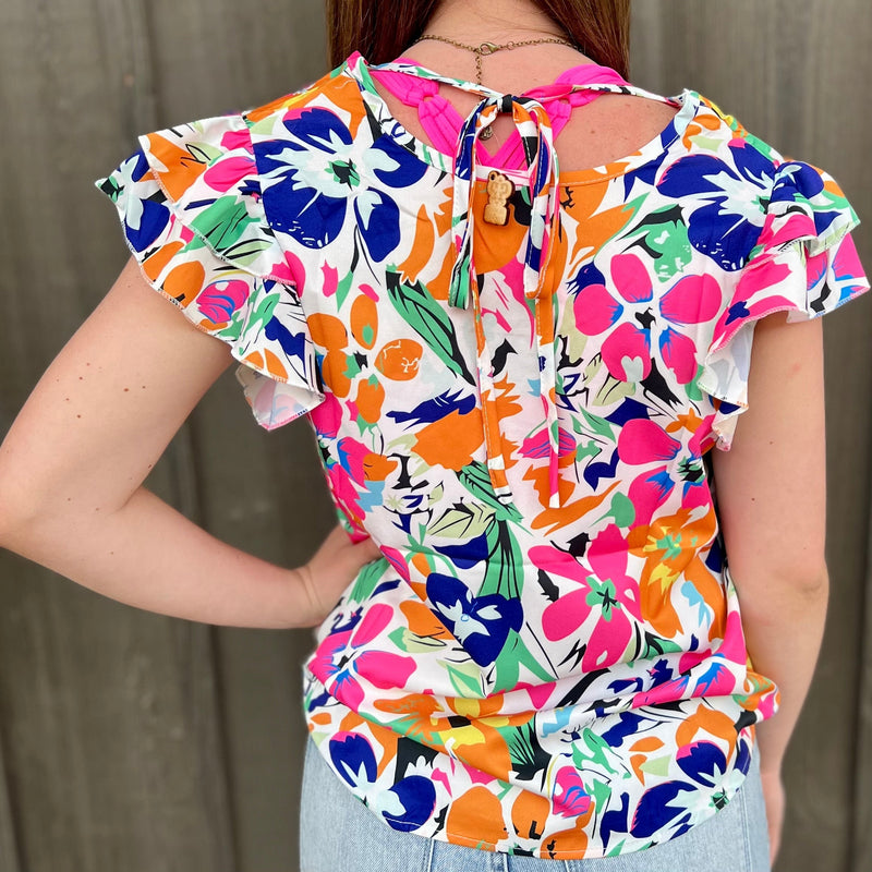 This Aloha Island Top is the perfect combination of style and comfort. Crafted from 95% Polyester and 5% Spandex, it features a timeless floral print, back tie, flutter sleeve blouse, and ruffle tiered sleeves that will help you stand out. The bright multi-colored hues offer a vibrant touch. Create your own unique looks with this versatile top!