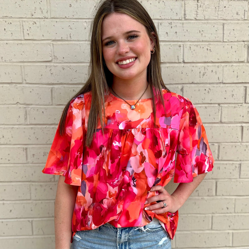 The Garden Rich Blouse will quickly become your go-to top for effortless style. Featuring a classic red floral print, plus wide sleeves for a relaxed look, you'll look effortlessly chic. Made of breathable fabric, it's both comfortable and stylish.  100% Polyester